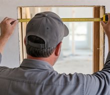 Supervisor checking progress against drawings on an active site